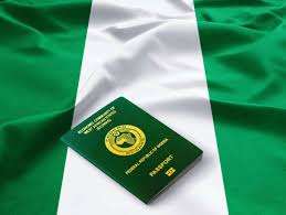 alt = " a Nigerian map and passport to show immigration in Nigeria" 